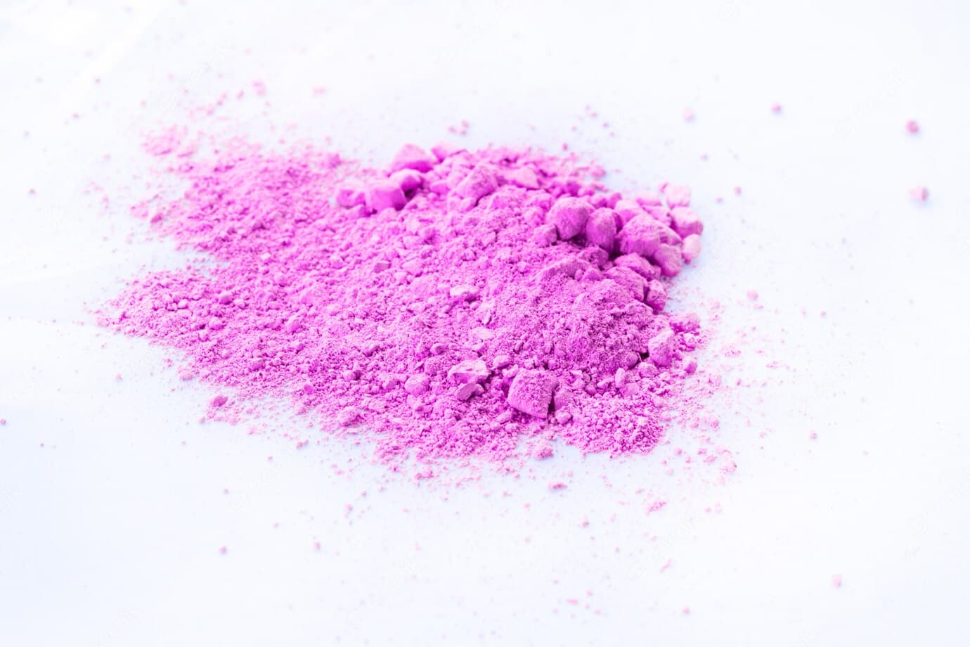 Purple chemical powder on a white background